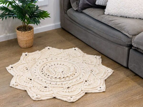 Crochet floor rug in front of a couch
