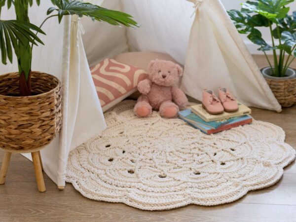 Crochet floor rug in front of teepee