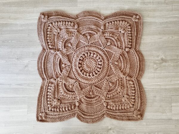 Square, textured crochet floor rug