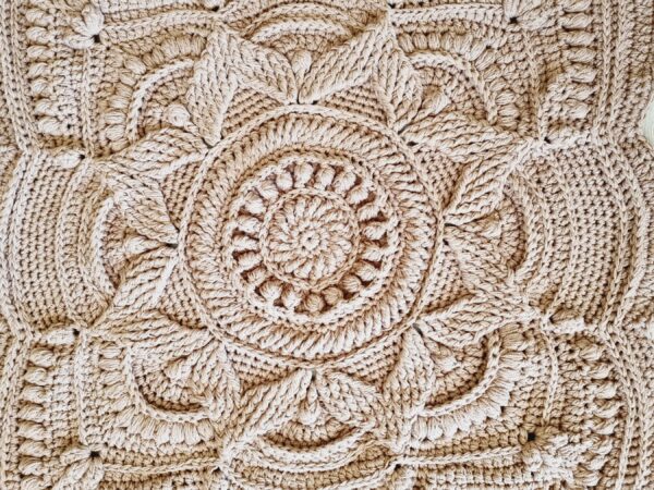 Square, textured crochet floor rug