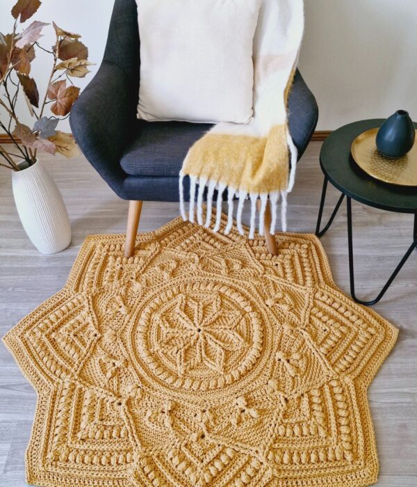 Crochet floor rug in front of chair.