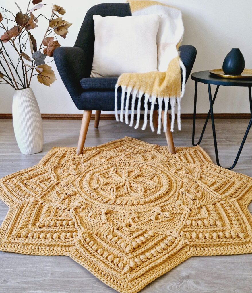 Crochet floor rug in front of chair.