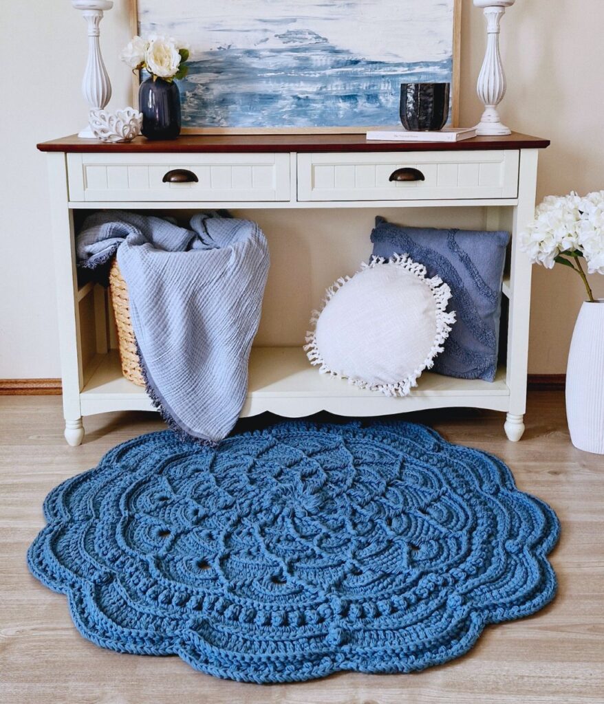 Blue crochet floor rug in front of Hamptons style hall table.